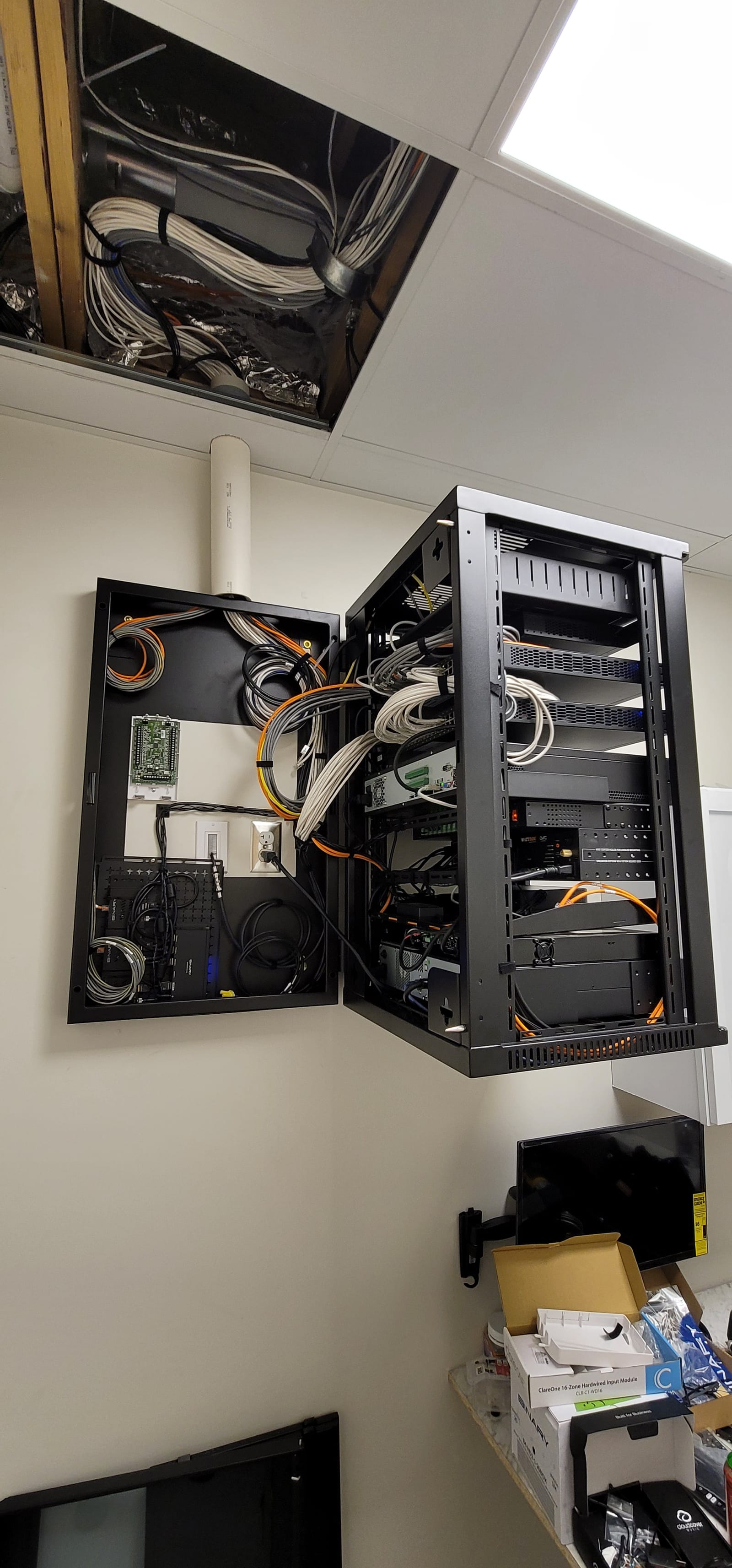 AV equipment rack with cover removed, showing carefully dressed and color-coded cabling, example of Noble A-V's wiring standards