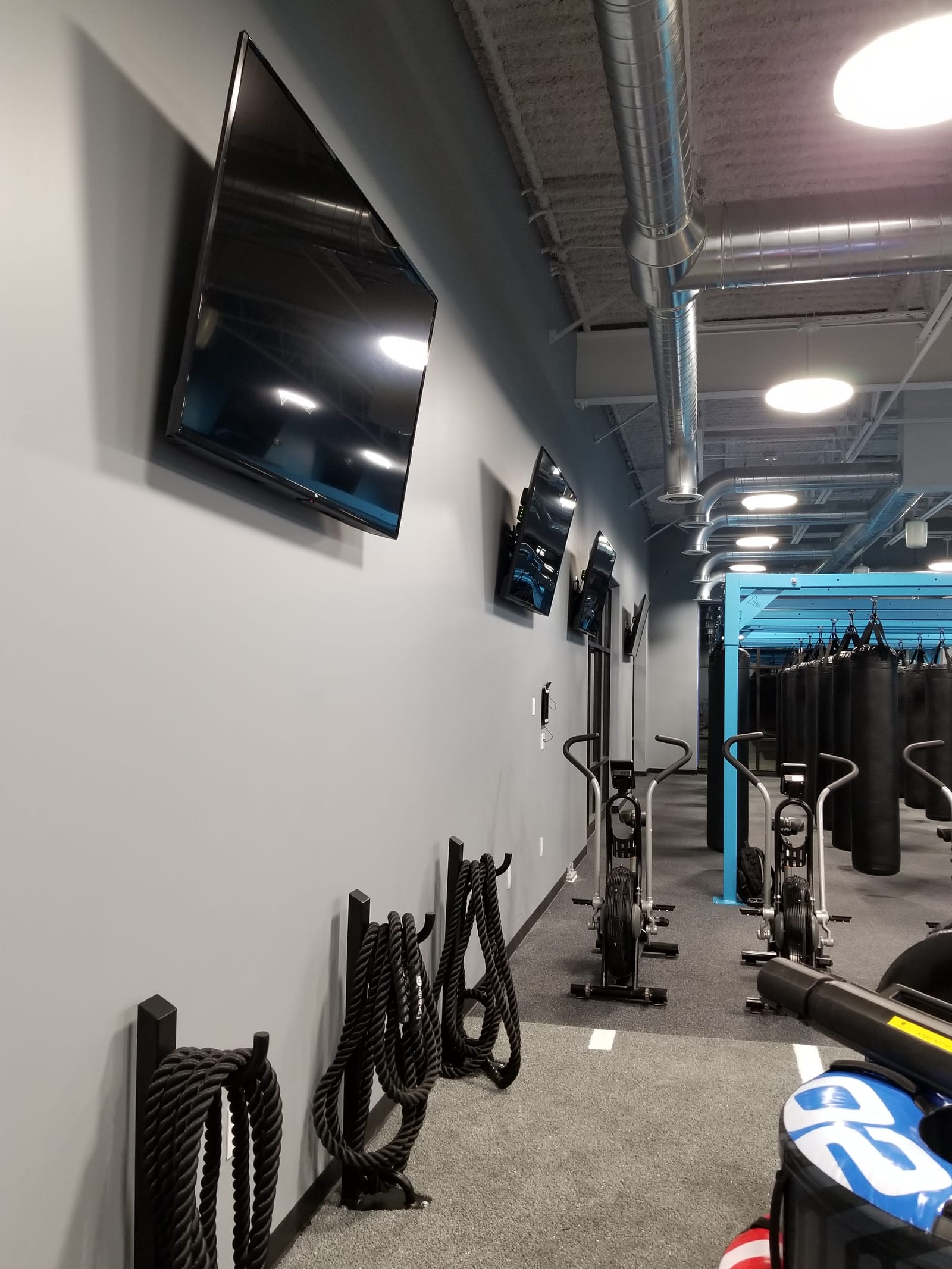 Gymnasium AV install showing multi-display layout