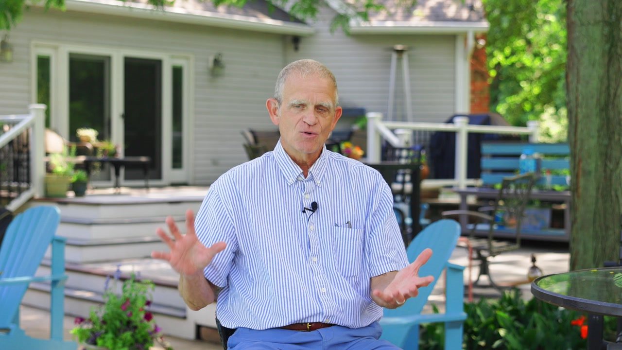 Don M., a Noble Audio & Video client, on his deck describing the outdoor audio system installed across his property