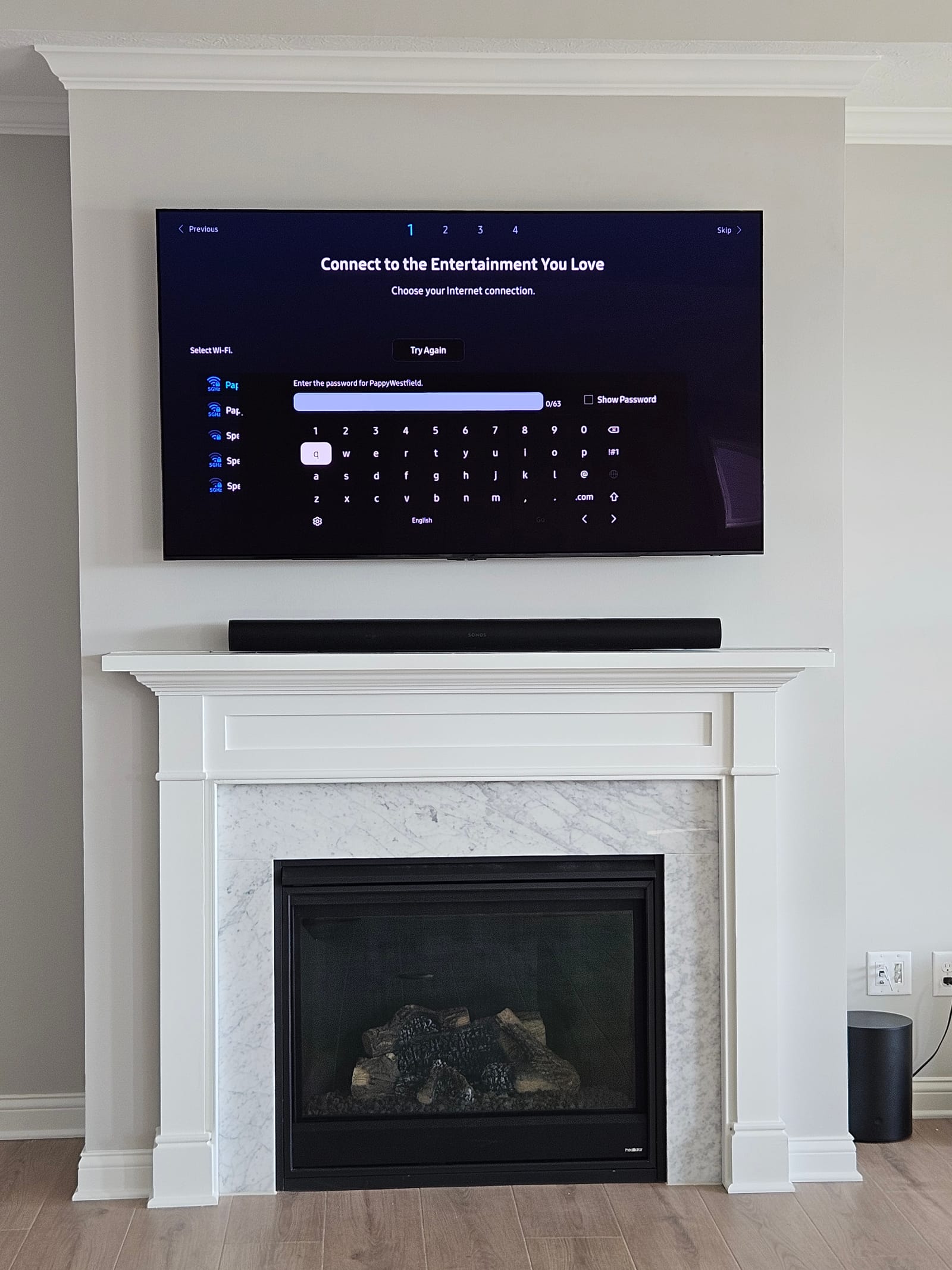 Flat-panel television mounted above a fireplace in a luxury Indianapolis-area home